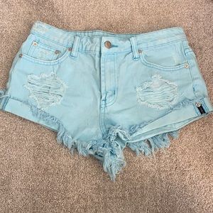 Light blue ripped jean shorts